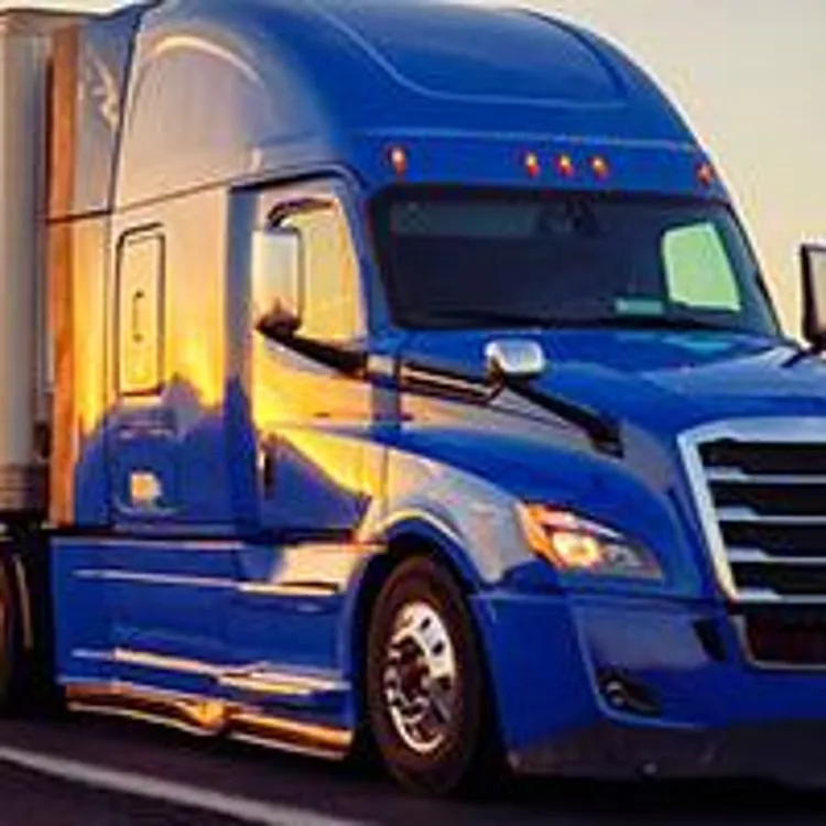 blue moving truck on desert highway