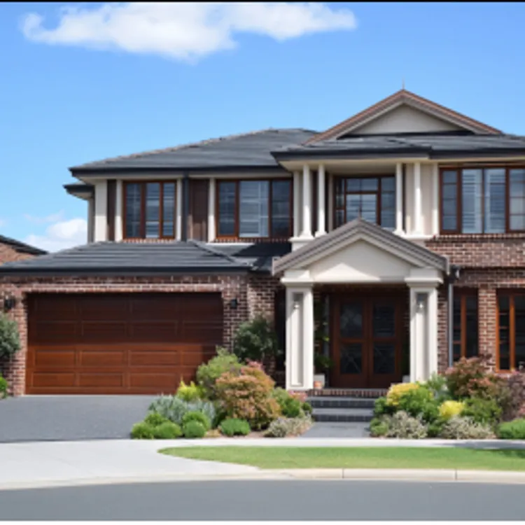 a nice home with large windows and front yard planted with pretty bushes