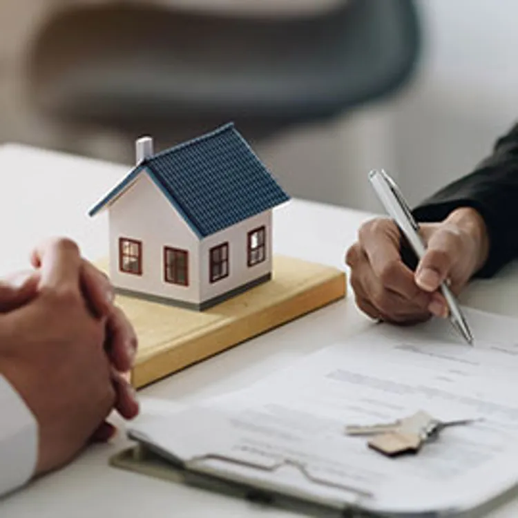 mortgage documents signing with mini house