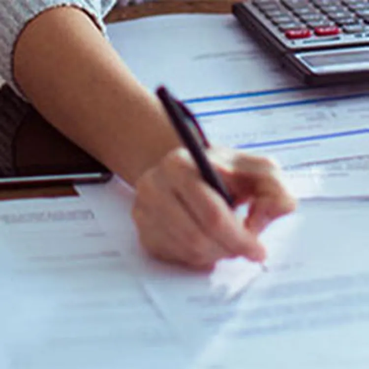 woman working on financial statements