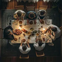 a family eating together at dinner table