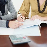 banker showing potential borrower sample loan term computations