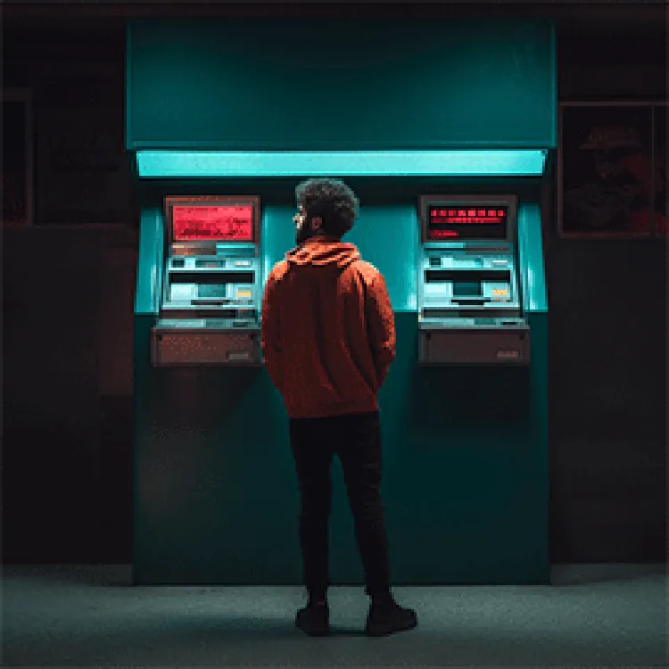 man standing in front of ATM machines