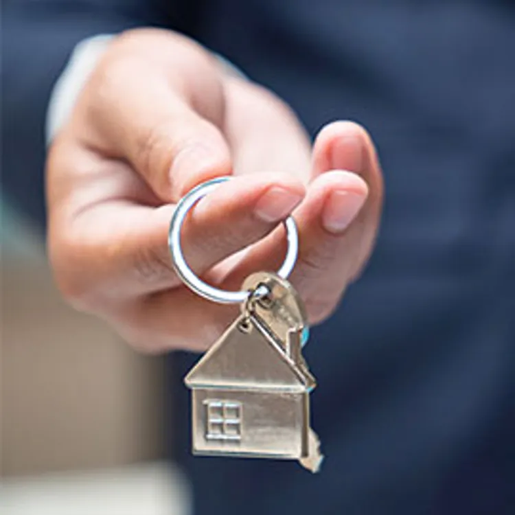 man holding a house key