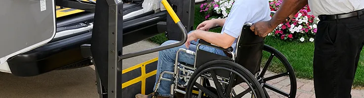 man on wheelchair lift