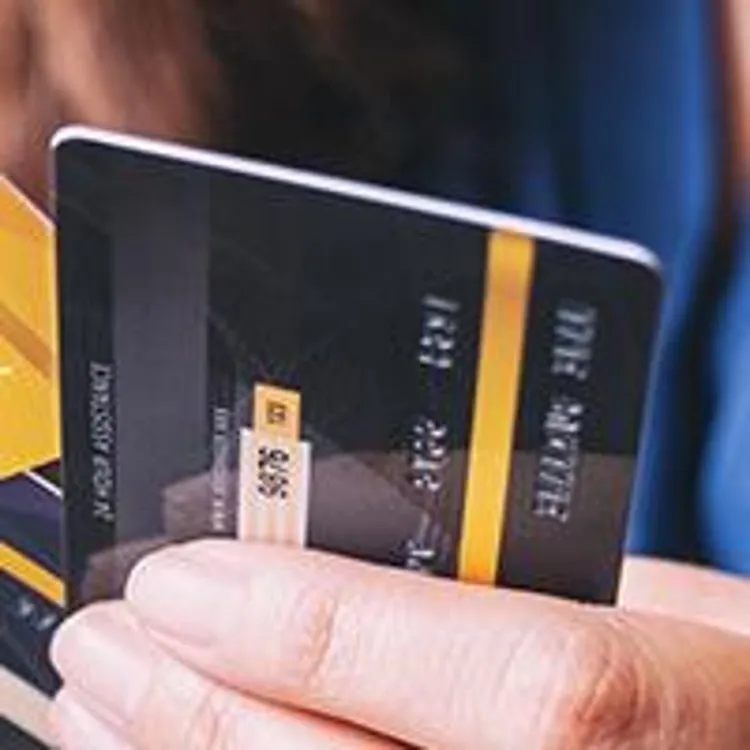 woman holding credit cards