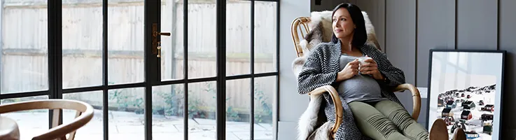 woman looking out window