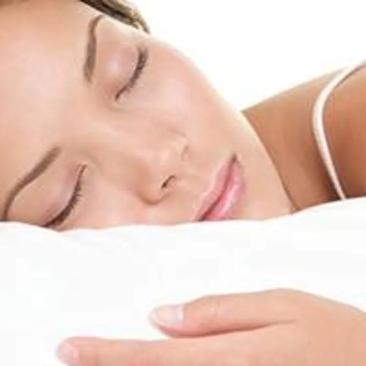 woman sleeping on bed