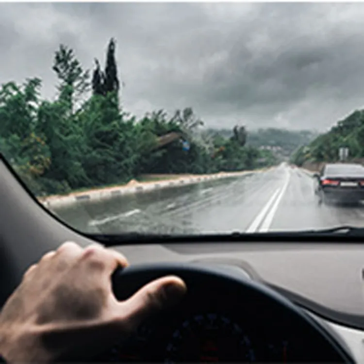 Guy driving on wet roads