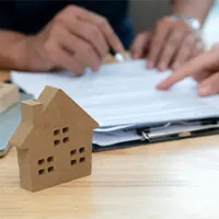 homeowner reading through a home warranty contract