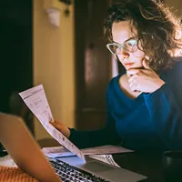 woman looking at document