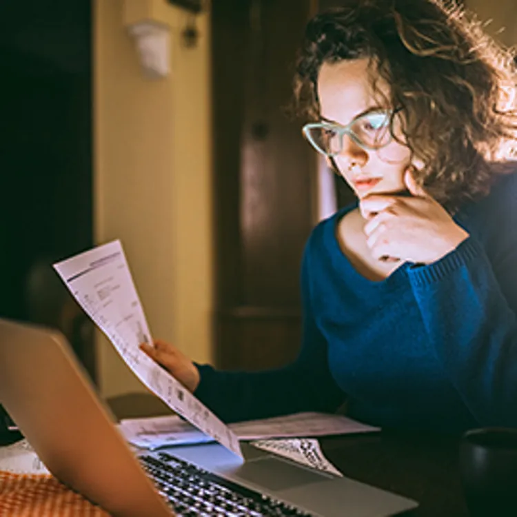 woman looking at document
